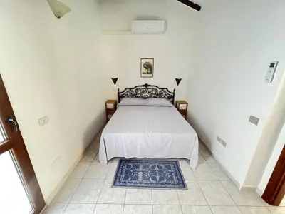 Letto o letti in una camera di Appartamento Nassia 1 By La Via Del Mare Viaggi e Vacanze