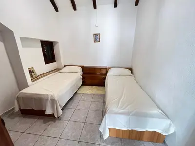 Letto o letti in una camera di Appartamento Nassia 2 By La Via Del Mare Viaggi e Vacanze