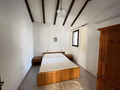 Letto o letti in una camera di Appartamento Nassia 2 By La Via Del Mare Viaggi e Vacanze