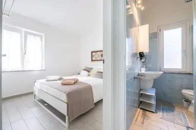 Letto o letti in una camera di Casa delle Sorelle