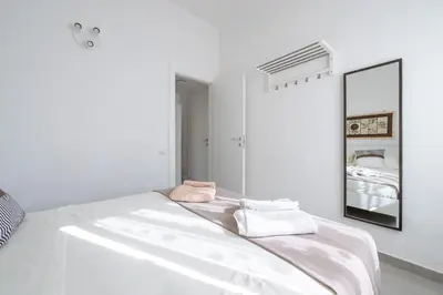 Letto o letti in una camera di Casa delle Sorelle
