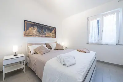Letto o letti in una camera di Casa delle Sorelle
