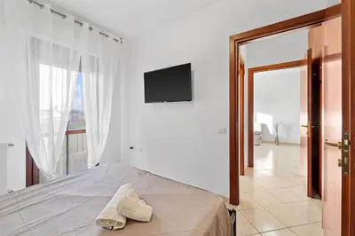 Letto o letti in una camera di CagliariParadiseApartament Waves