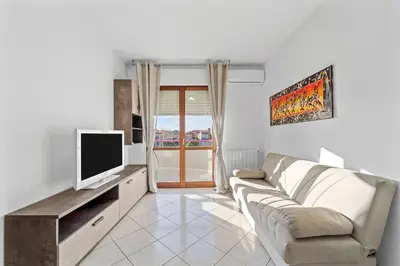 TV o dispositivi per l'intrattenimento presso CagliariParadiseApartament Waves