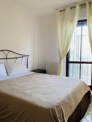 Letto o letti in una camera di CagliariParadiseApartament Waves