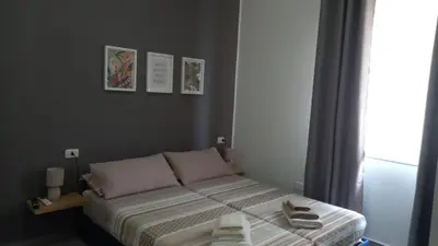 Letto o letti in una camera di PALM House Affitta camere