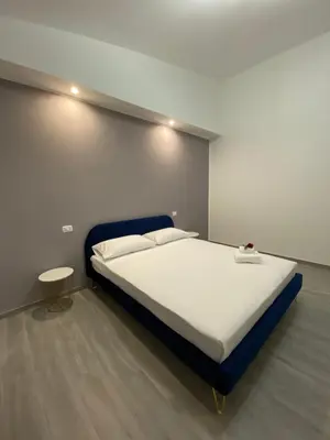 Letto o letti in una camera di PALM House Affitta camere