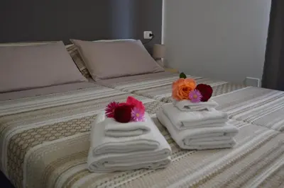 Letto o letti in una camera di PALM House Affitta camere