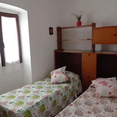 Letto o letti in una camera di Martino10