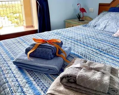 Letto o letti in una camera di Appartamento I Fenicotteri - Pula