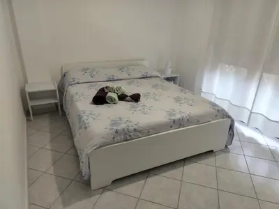 Letto o letti in una camera di Apartment with private parking spot in Oristano's city center