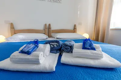 Letto o letti in una camera di Villa Tre Mari