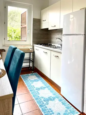 Cucina o angolo cottura di Domu Mea 1 min a Piedi dal Mare