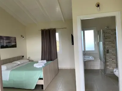 Letto o letti in una camera di Is Arenas Biancas Agriturismo