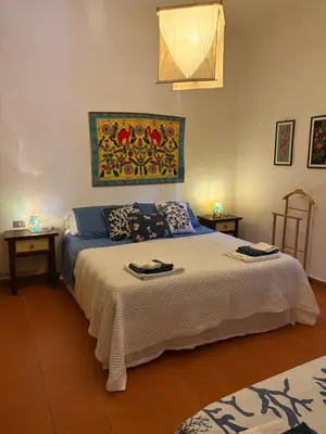Letto o letti in una camera di Casa l’orizzonte azzurro
