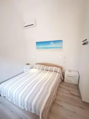 Letto o letti in una camera di Appartamento due passi dal mare