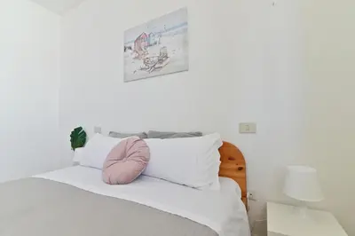 Letto o letti in una camera di IzzHome Maris