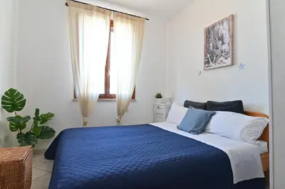 Letto o letti in una camera di IzzHome Maris