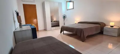 Letto o letti in una camera di A 2 passi dalla spiaggia