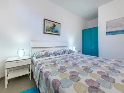 Letto o letti in una camera di Sardinia SPA Apartment