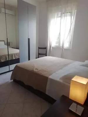 Letto o letti in una camera di Casa Clara Oristano centro con giardino