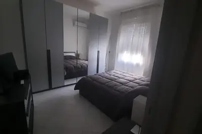 Letto o letti in una camera di Casa Clara Oristano centro con giardino