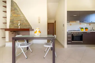 Cucina o angolo cottura di Villa Regina - Doppia villetta vista mare con giardino e BBQ