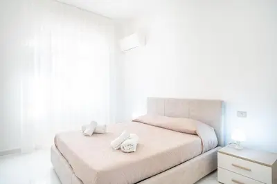 Letto o letti in una camera di San Rocco Apt, Villanova