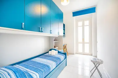 Letto o letti in una camera di San Rocco Apt, Villanova