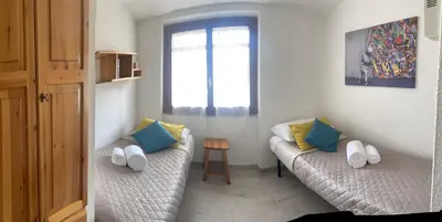 Letto o letti in una camera di Casa vacanze a tre minuti a piedi dal mare