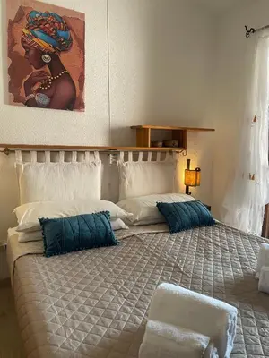 Letto o letti in una camera di Casa vacanze a tre minuti a piedi dal mare