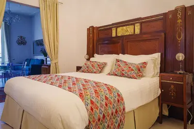 Letto o letti in una camera di WATERFRONT SUITES CAGLIARI
