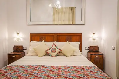Letto o letti in una camera di WATERFRONT SUITES CAGLIARI