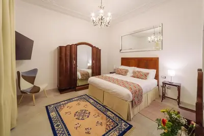 Letto o letti in una camera di WATERFRONT SUITES CAGLIARI