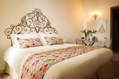 Letto o letti in una camera di WATERFRONT SUITES CAGLIARI