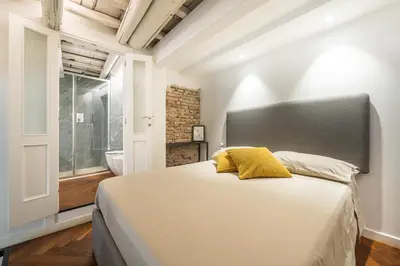 Letto o letti in una camera di Genovesi - Appartamento design in centro storico