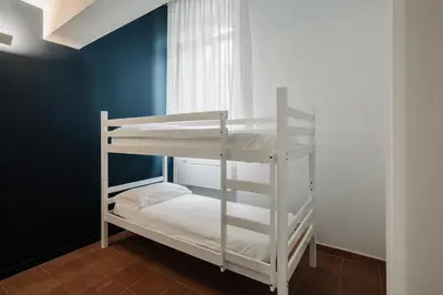 Letto o letti in una camera di OSTELLO HENRY