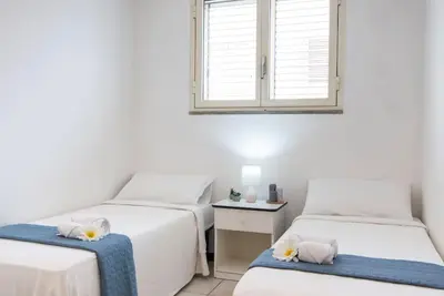 Letto o letti in una camera di [Torregrande]APT.1-Con terrazzo a pochi metri dal mare - Free Wi-Fi
