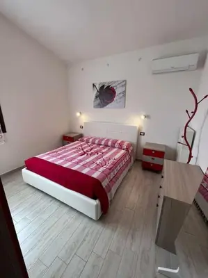 Letto o letti in una camera di Sa domu nosta è un appartamento.