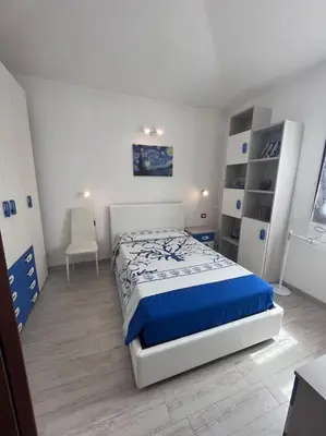 Letto o letti in una camera di Sa domu nosta è un appartamento.