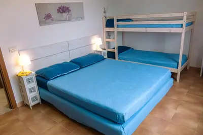 Letto o letti in una camera di Calasetta Comfy Apartment x5 - w/ Terrace