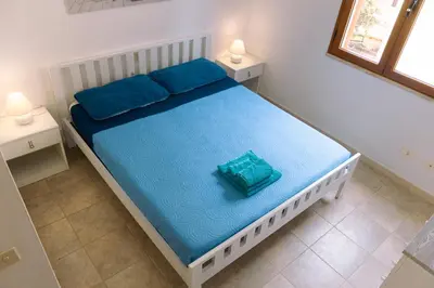 Letto o letti in una camera di Calasetta Comfy Apartment x5 - w/ Terrace