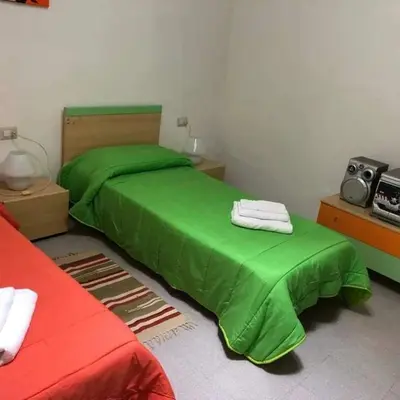 Letto o letti in una camera di Casa vacanze Antonella