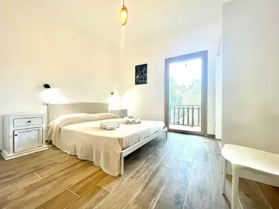 Letto o letti in una camera di Le Corti Sarde Beach Apartments