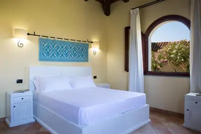 Letto o letti in una camera di Cala Luas Resort