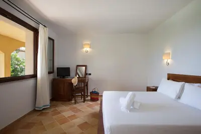 Letto o letti in una camera di Cala Luas Resort