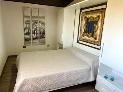 Letto o letti in una camera di Casale fronte mare - villa with swimming pool in front of the beach