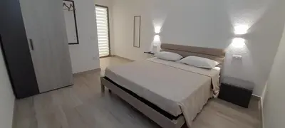 Letto o letti in una camera di Villasimius Appartamento 