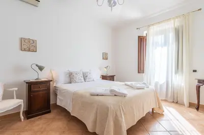Letto o letti in una camera di Residenza Parco degli Ulivi
