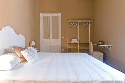 Letto o letti in una camera di BluLassù City Center Rooms